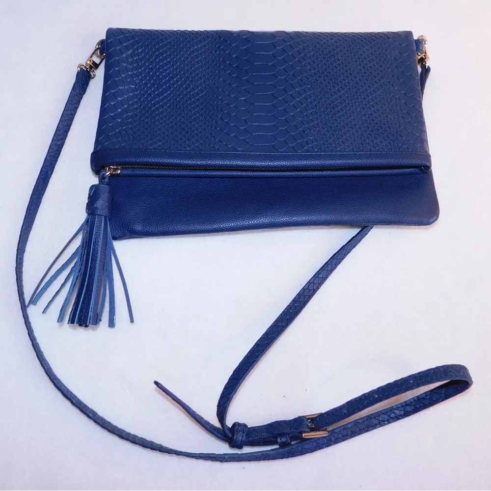 Genuine leather blue colored over the shoulder bag and laptop case.